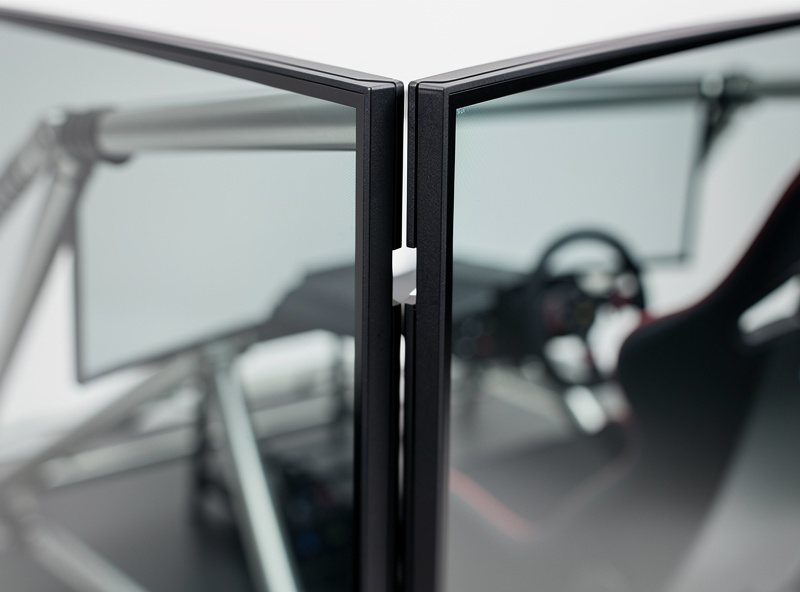 Close-up of bezel gap between two monitors in triple sim racing setup