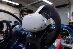 Meta Quest 3 VR headset on a direct-drive sim racing wheel