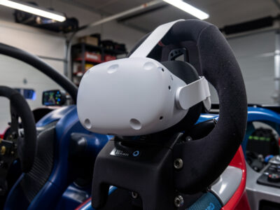 Meta Quest 3 VR headset on a direct-drive sim racing wheel