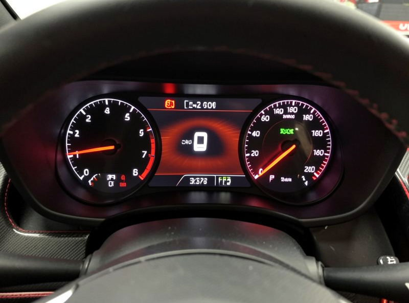 Sim racing dashboard overlay showing fuel level and laps remaining during an endurance stint