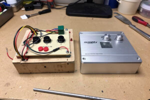 A DIY Arduino button box and a pre-built aluminium button box side by side
