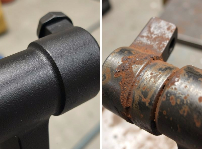 Close-up of a powder-coated matte black steel sim rig joint versus surface rust starting on bare steel