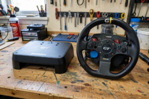 Formula and GT sim racing rims side by side showing the shape difference