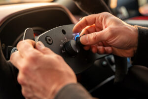 Sim racer adjusting wheelbase torque on a direct-drive base