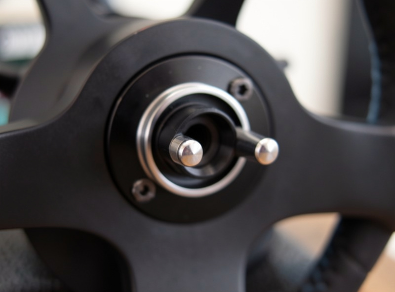Quick-release coupling contact pins as a rim attaches to a direct-drive base
